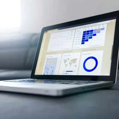 A founder modelling a team budget on a laptop